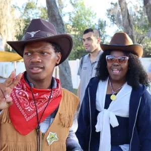 Students dressed in cowboy-themed outfits during a Focus Academy spirit day event.