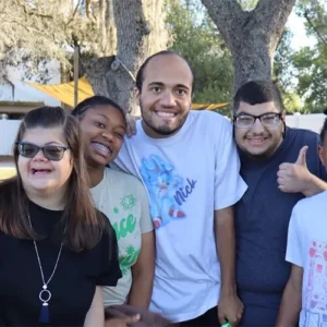 Group of smiling Focus Academy students posing together outdoors.