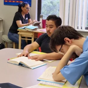 Focus Academy students reading quietly at a classroom table.