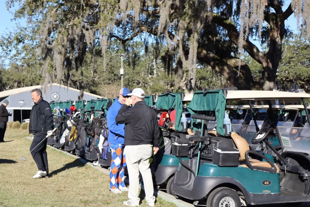 Players loading golf carts before the shotgun start