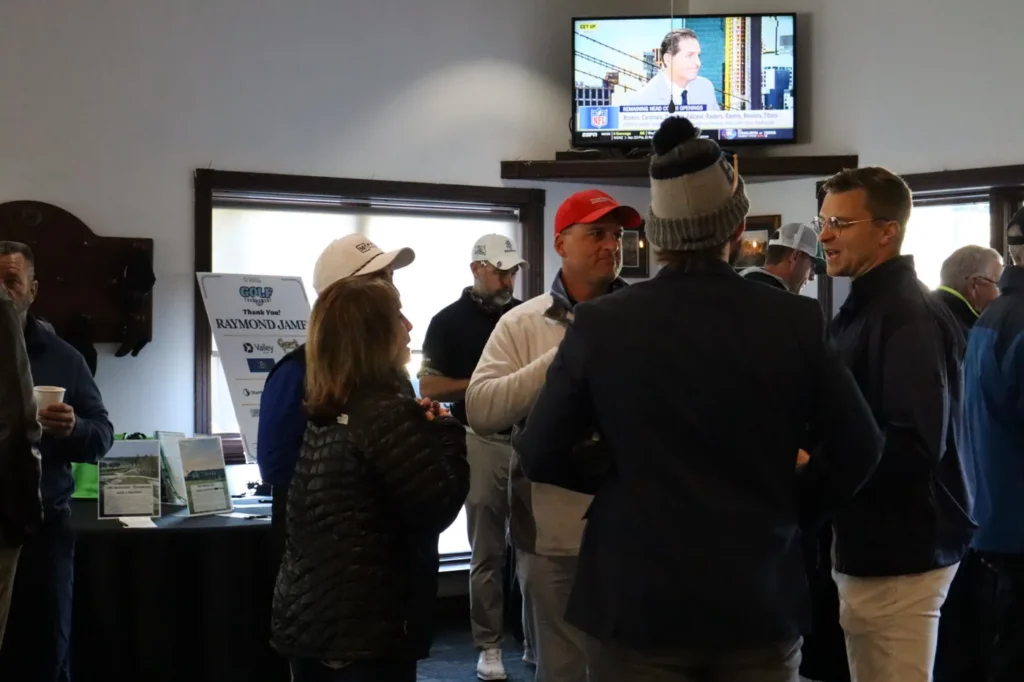 Players gathering inside the clubhouse before the round