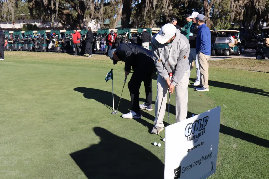Golfers at the putting green contest