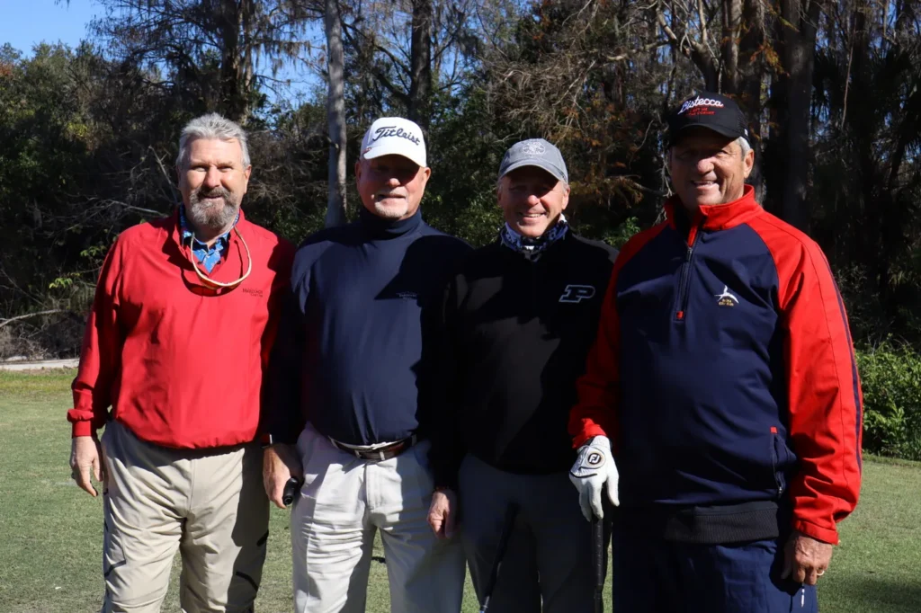 Team of four golfers before tee off