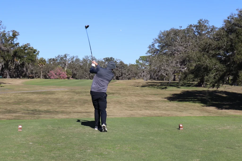 Golfer driving from the tee at the Project Focus Annual Golf Tournament